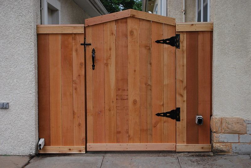 Wood gate in a concrete building entrance